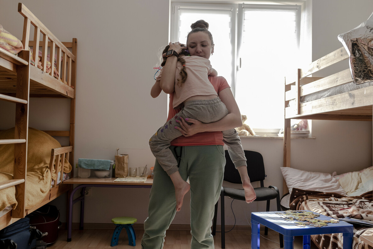 Oksana* and her daughter in their room at a shelter in a church in Lviv being supported with DEC funds. Image: Kasia Strek/DEC